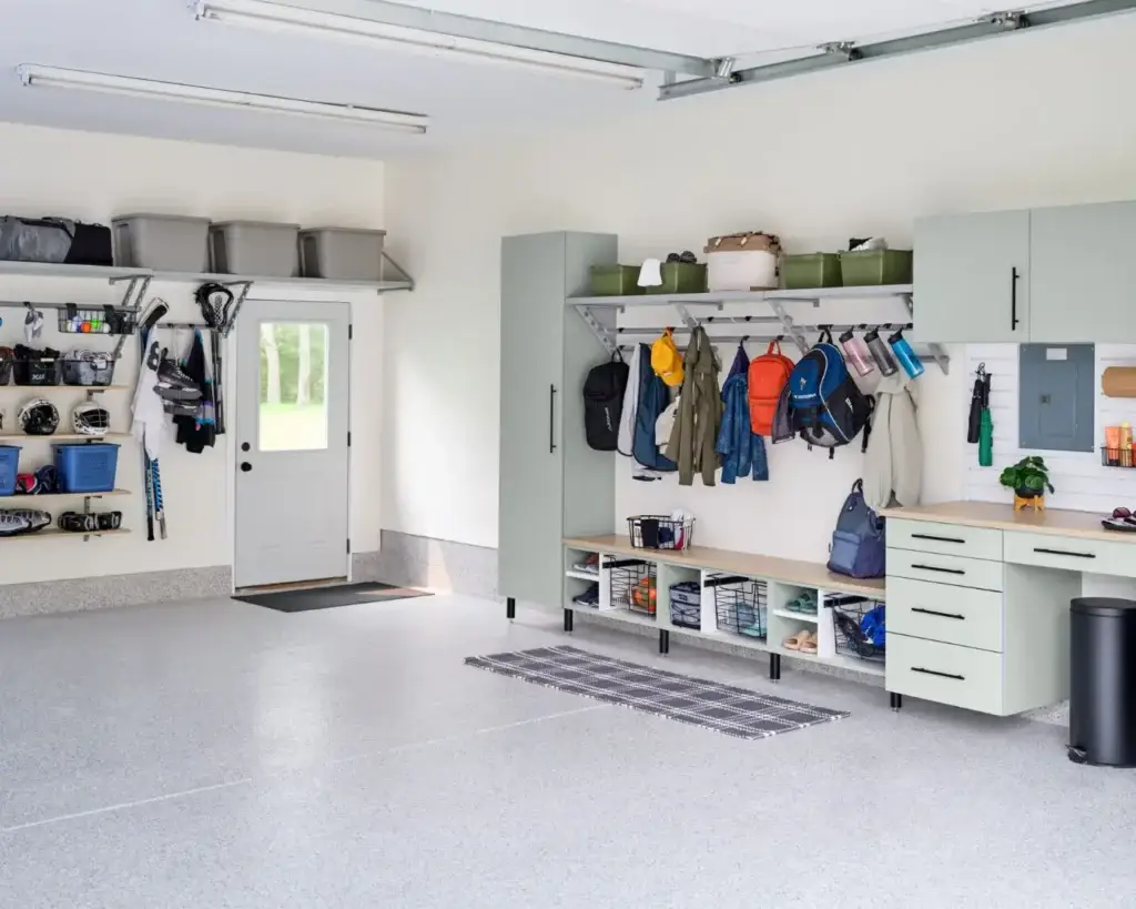 This image showcases our custom cabinets that has a bench, work station, slat wall, and our inverted Spartacus top shelf, Spartacus hanging racks, and shelving.