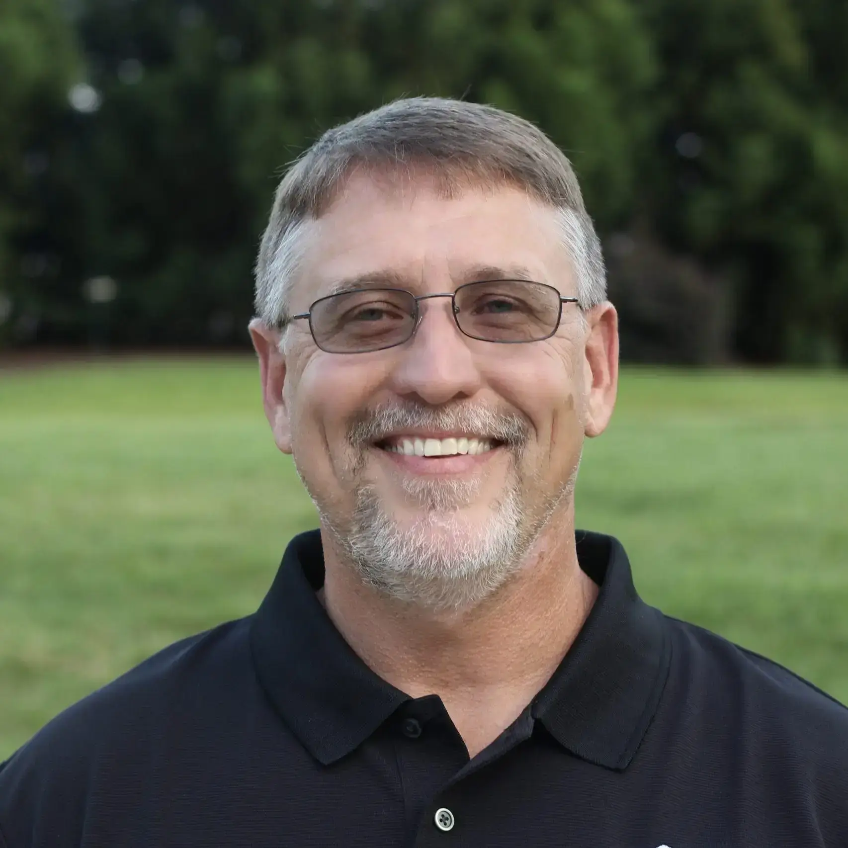 Chris Reed, owner of SmartSpace wearing a black polo shirt.