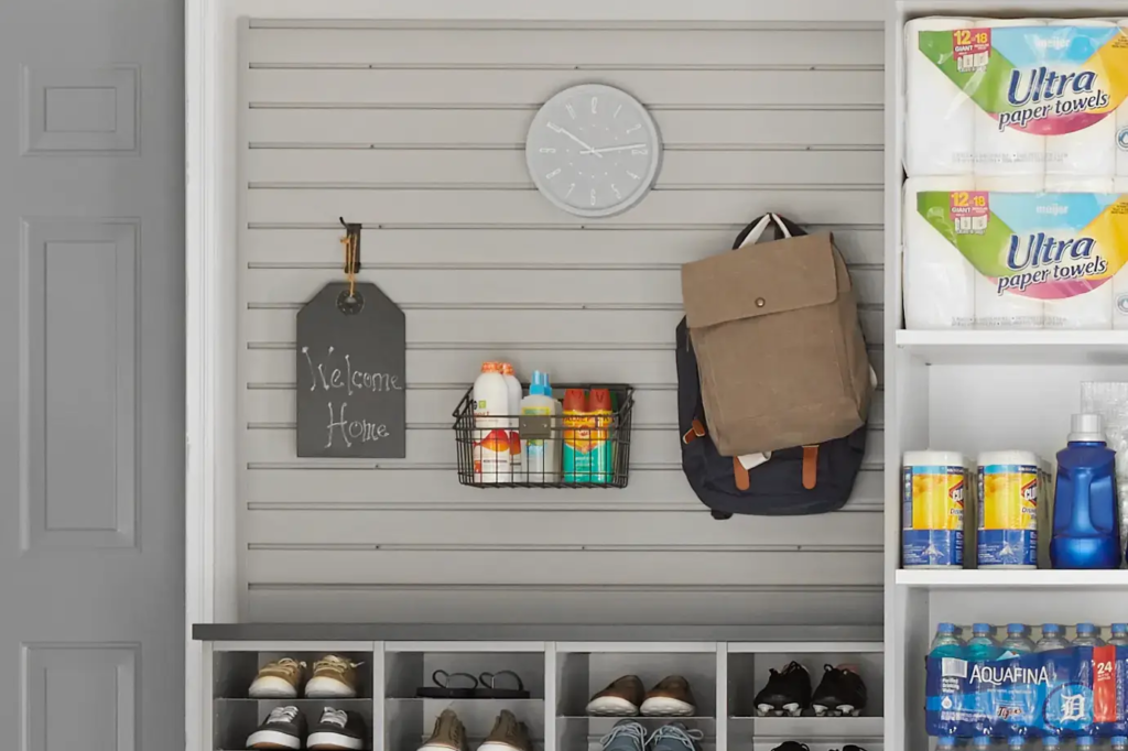 Entryway with slat wall and shelving